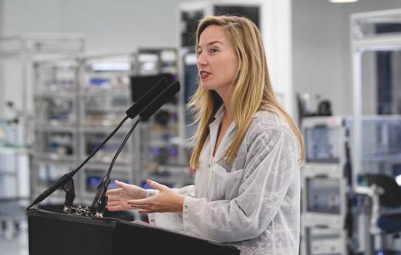 Tara O'Shea speaking at a podium