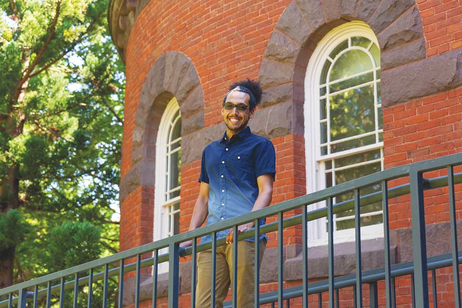 Weston Jackson standing outside in front of a brick building