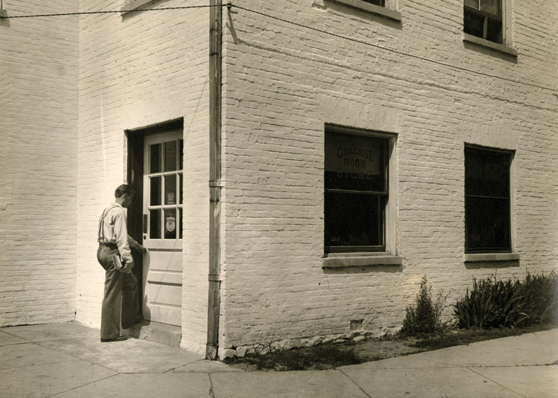 A student entering bookstore in Penn Hall