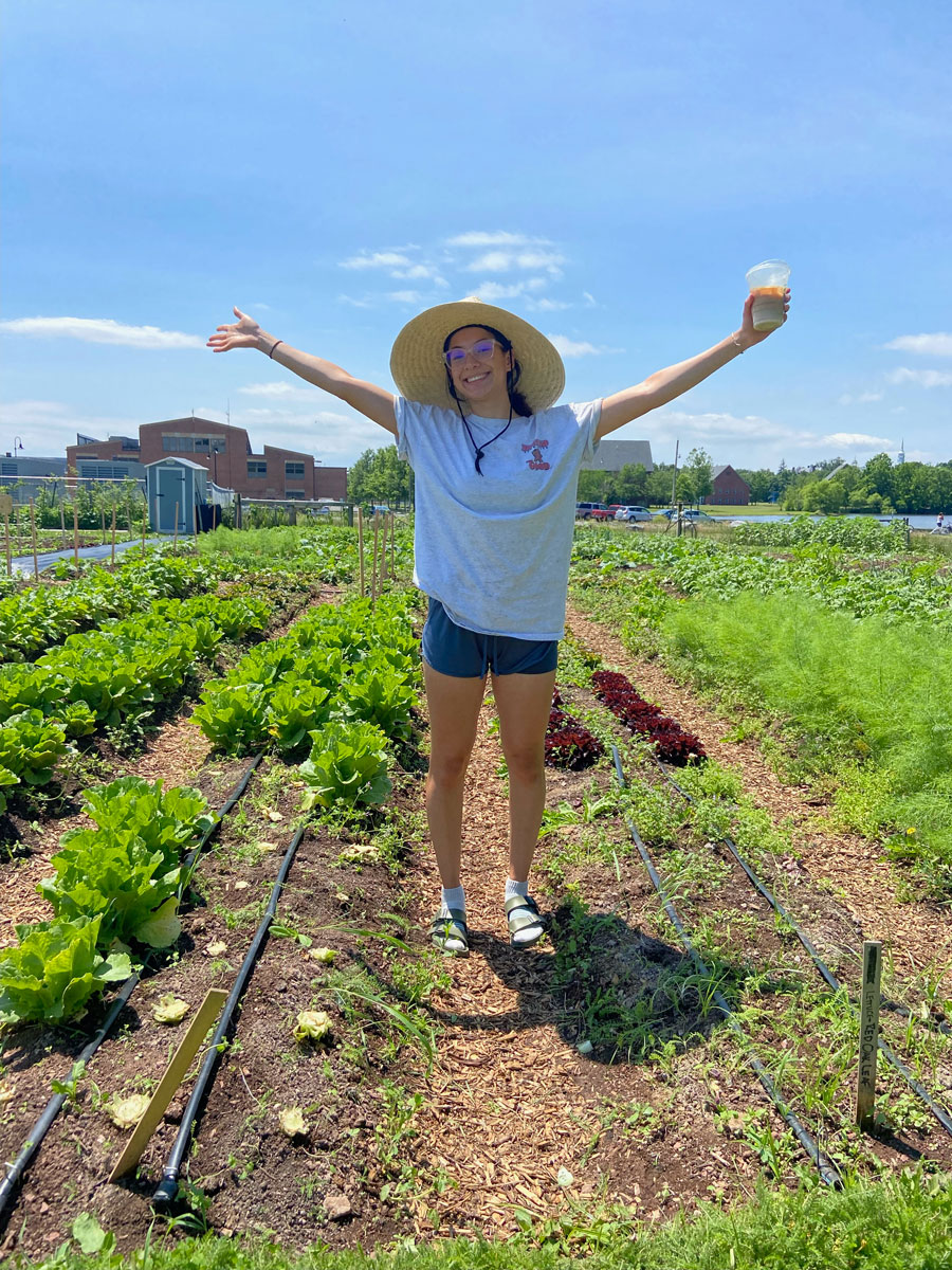 Adriana standing in a field at the Painted Turtle Farm