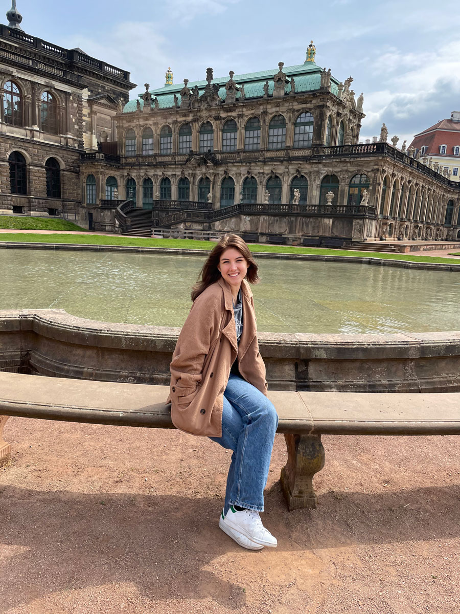 Aine Ford sitting in front of a fountain