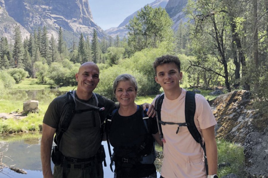 Prof. Anne S. Douds with her husband and son in the woods