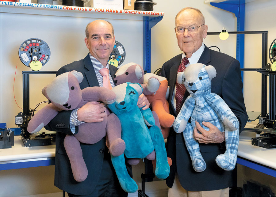 Rod Tosten with Roger Nelson holding Cueteddy bears