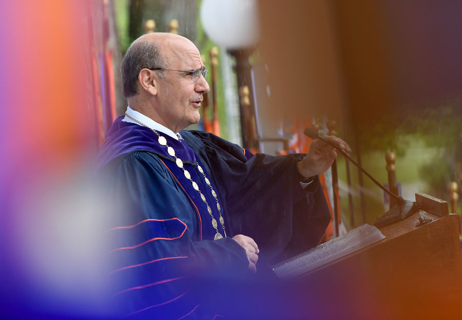 President Bob Iuliano speaking at a podium outdoors