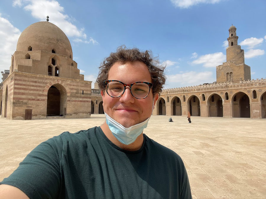 Brandon in the courtyard of a stone Mosque