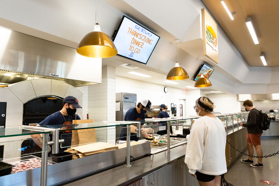 Student ordering a salad at the Bullet Hole