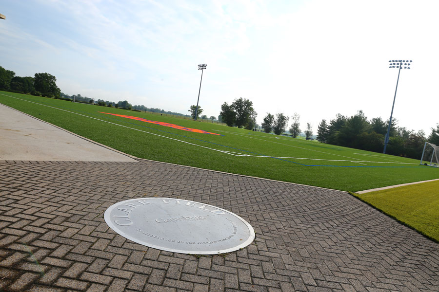 Clark Field with plaque on the ground