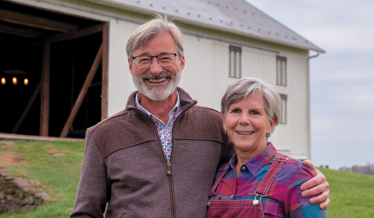 David and Cynthia Lecompte Salisbury standing in front of a barn