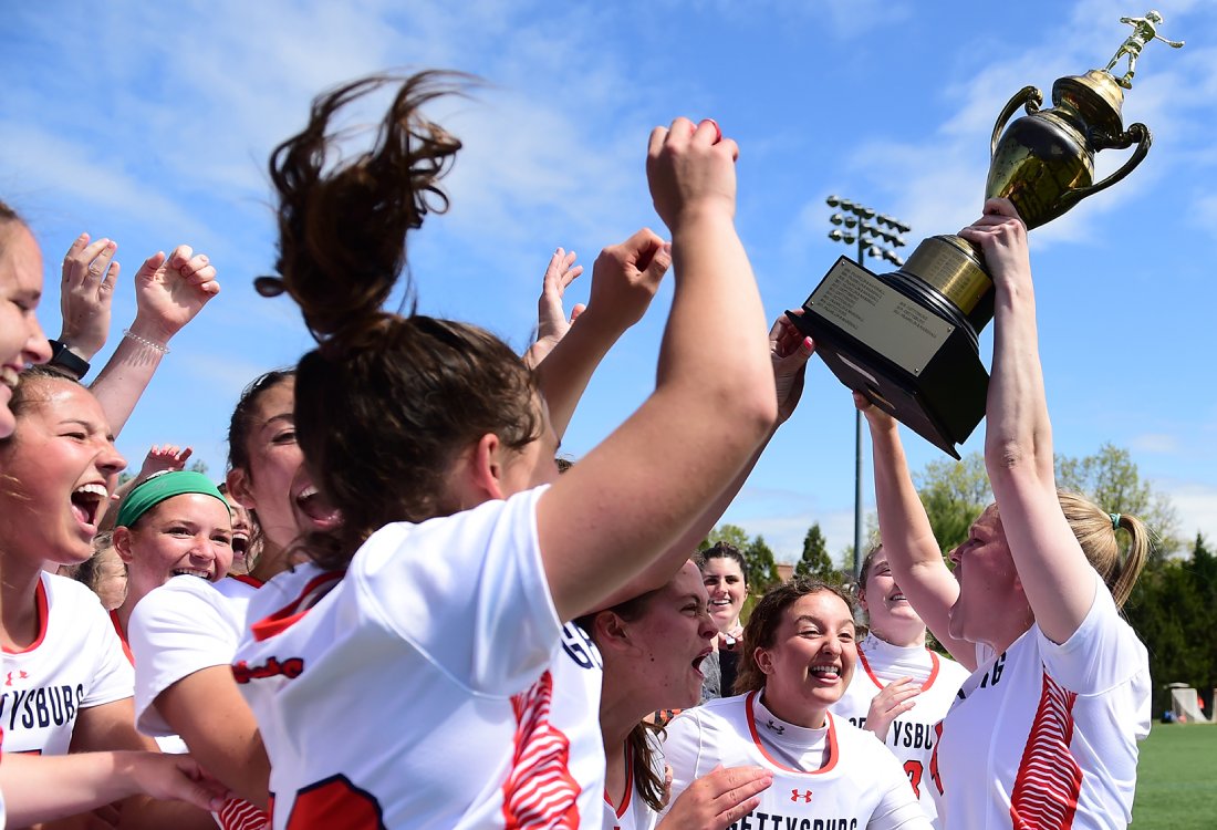 Team lifting up the trophy