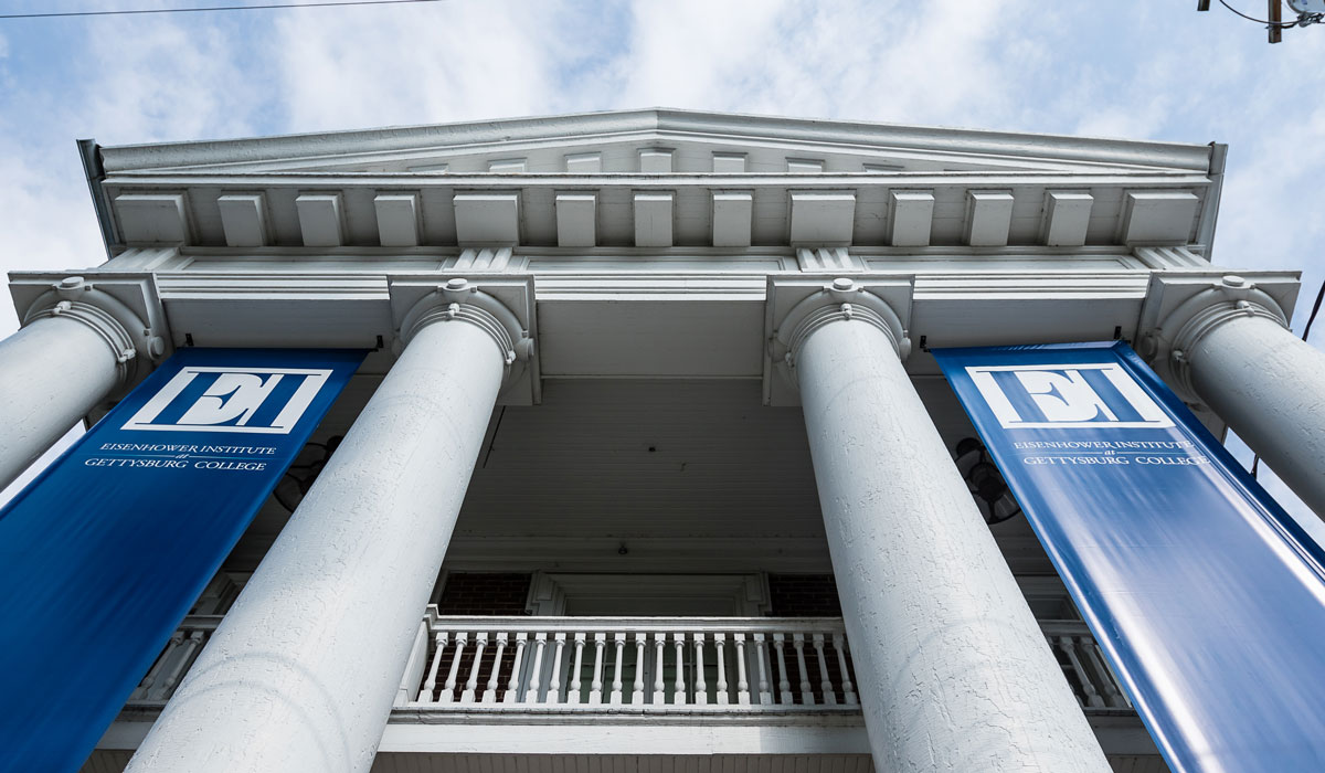 Front of Eisenhower Institute building with EI blue banners hanging down