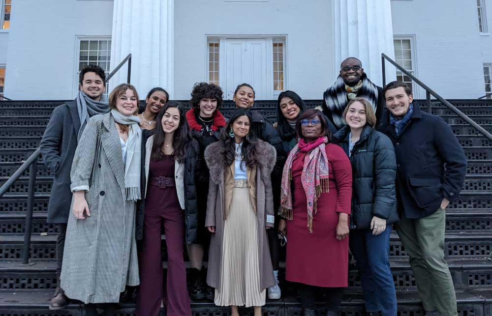 Group of diverse students standing in front of Penn Hall