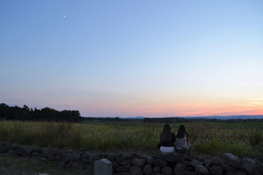 Students on the Gettysburg battlefield at dusk