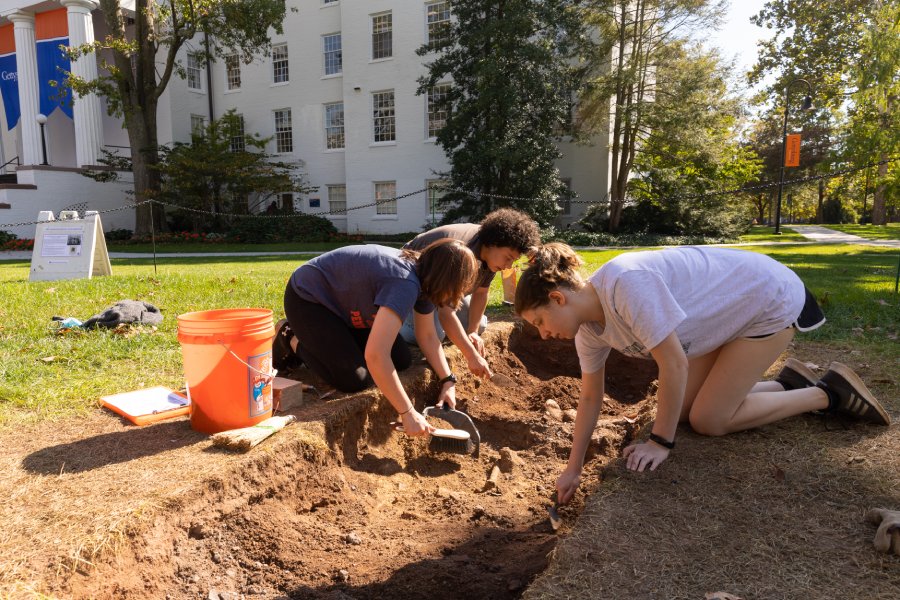 Students dig outside Penn Hall 