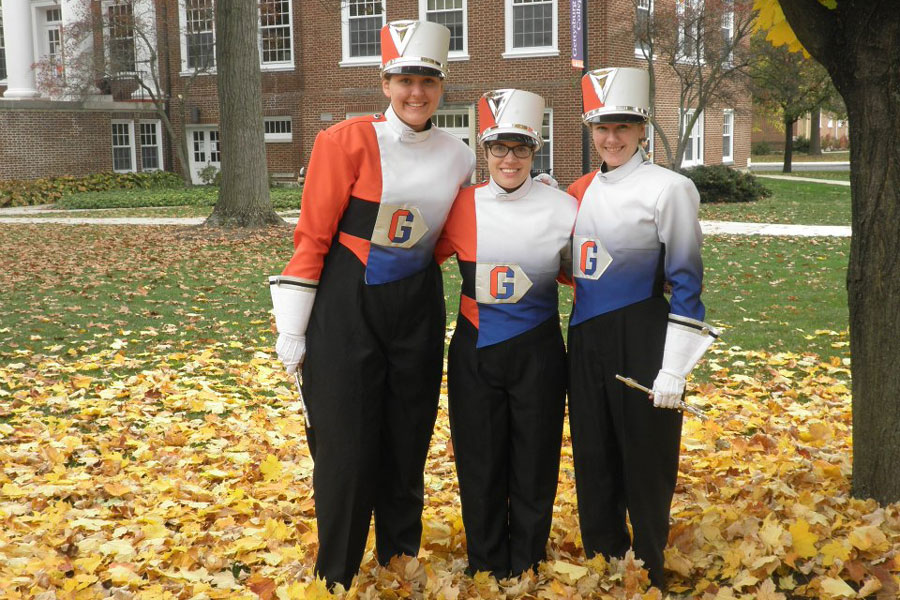 Caitlin Moss ’13 (left) with a few friends from the Bullets Marching Band