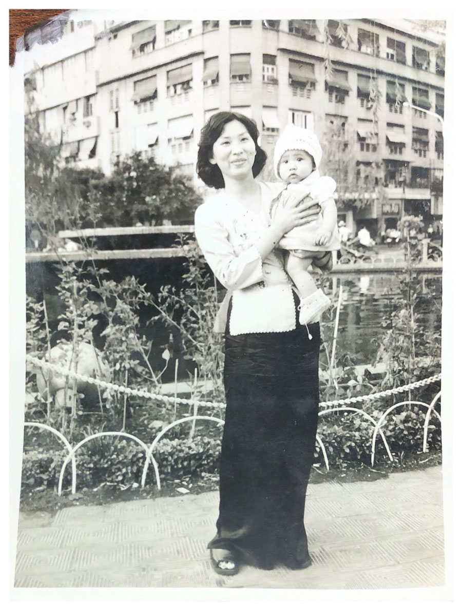 Murphy as a baby, being held by her mother, Luu Dang, in Vietnam