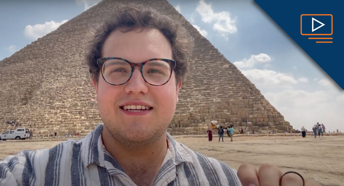 Brandon Neely standing in front of a pyramid in Egypt