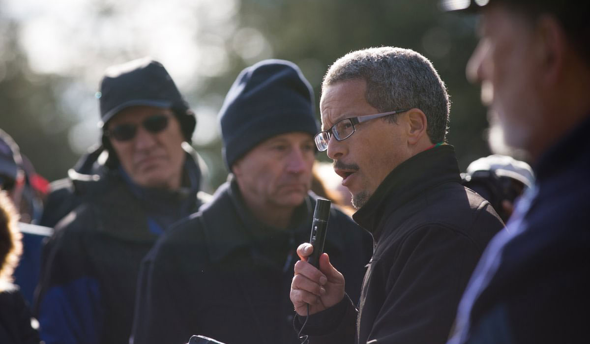 Scott Hancock speaking into a microphone