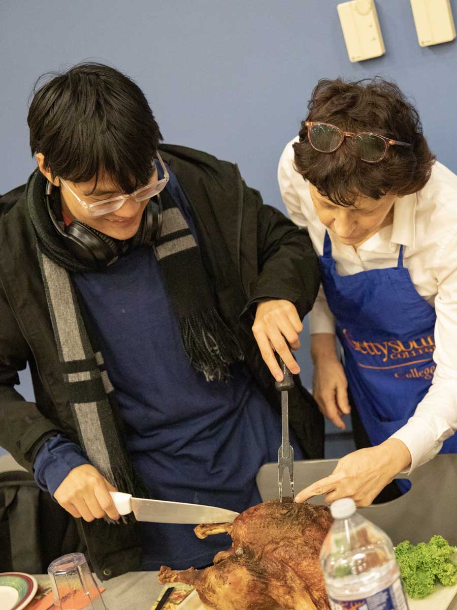 Student carving a turkey