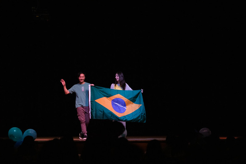 Two students holding Brazilian Flag