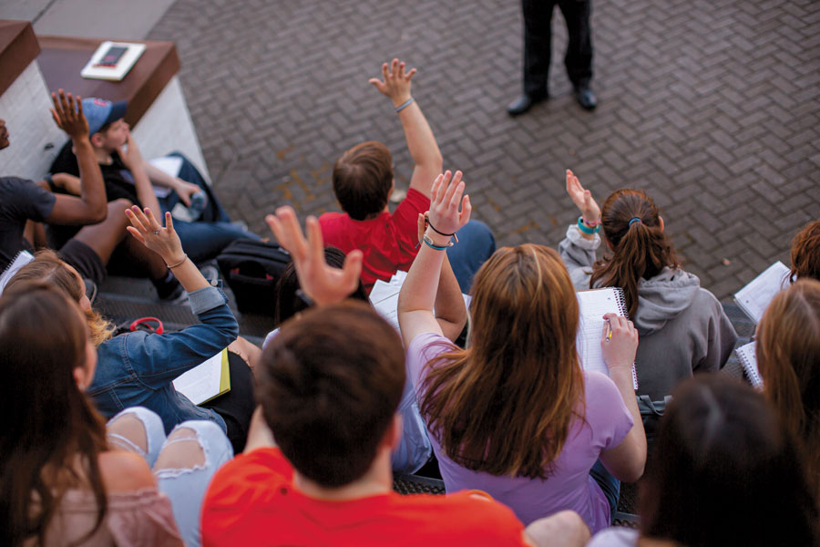 Students with raised hands