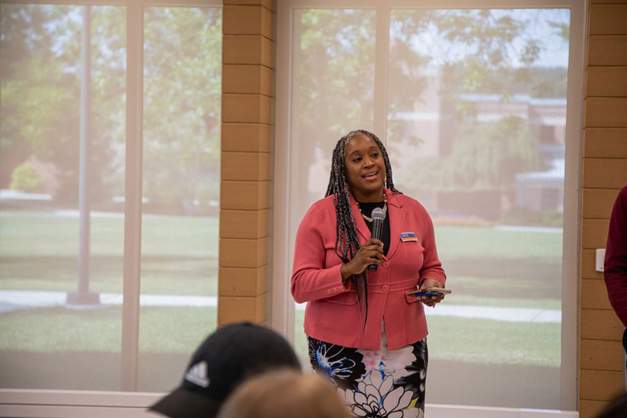 Tracie Potts speaking at a town hall