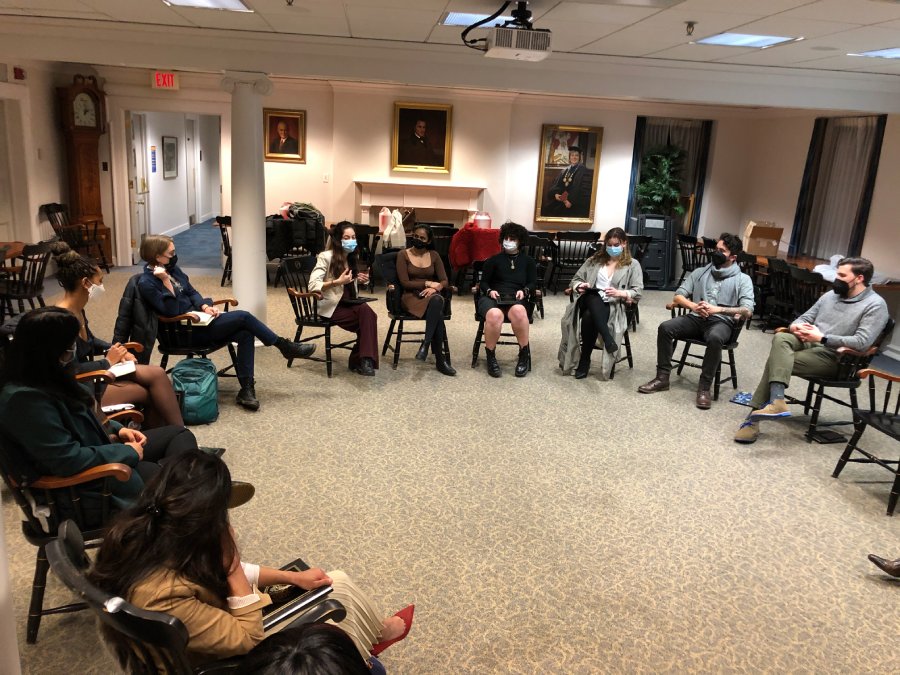 Transformative leadership fellows sit in a circle while engaging in discussion