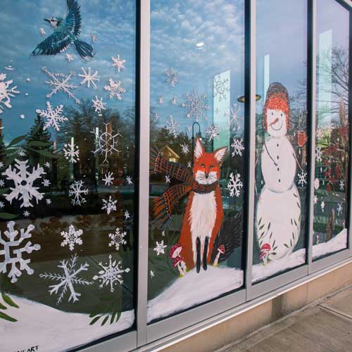 Painting of snowman and snowflakes on the windows of the JMR Center