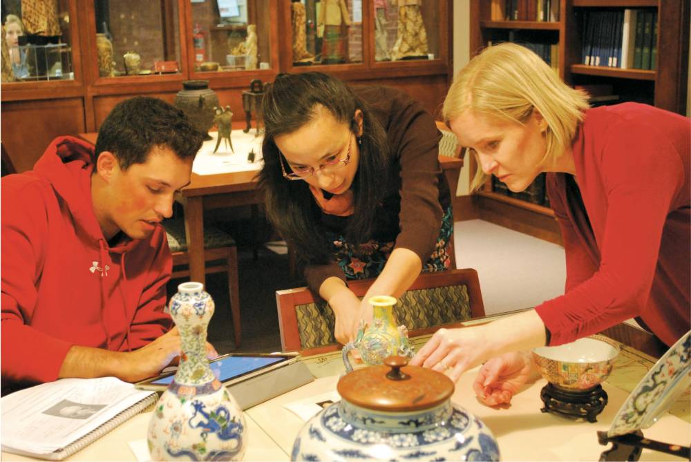 Prof. Yan Sun with a student and Catherine Perry, digital projects and Special Collections manager