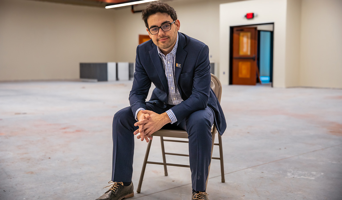 Adams County Historical Society Executive Director Andrew Dalton ’19 sits in a room