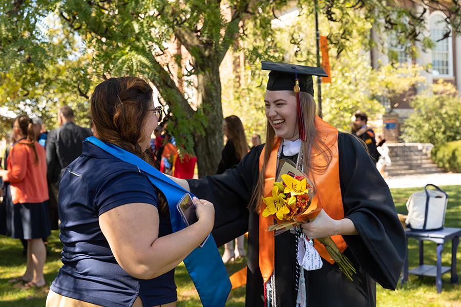 Jessica Greenman ’20 presents her Stole of Gratitude to Kelly Mathiesen,