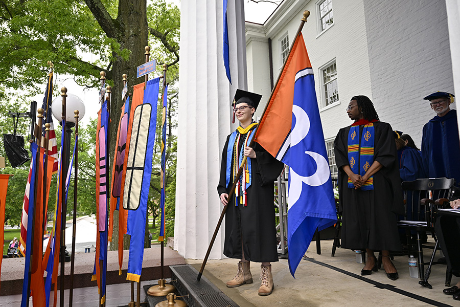 Valedictorian Bryn Werley ’23 carries the class flag