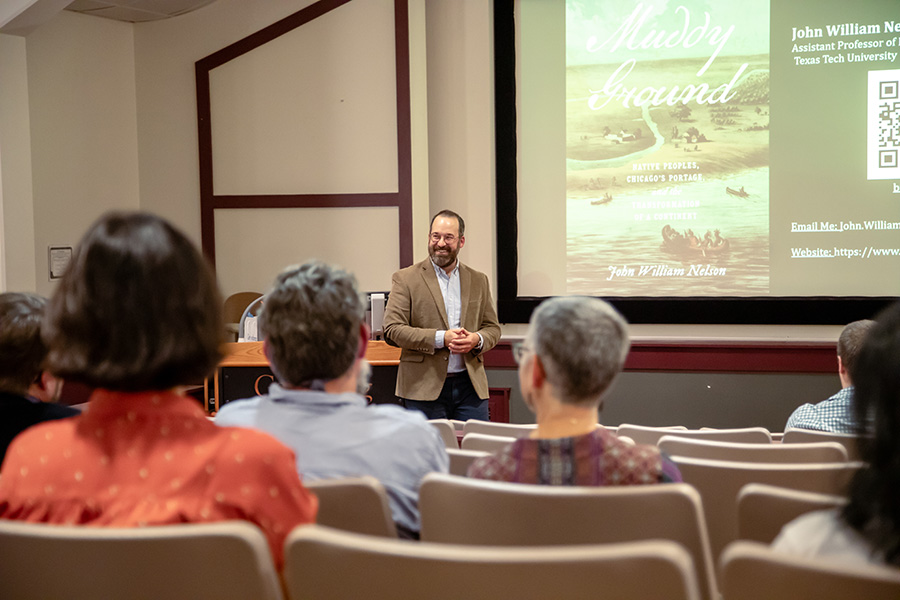John Nelson ’13, assistant professor of Early North American History at Texas Tech University giving a presentation