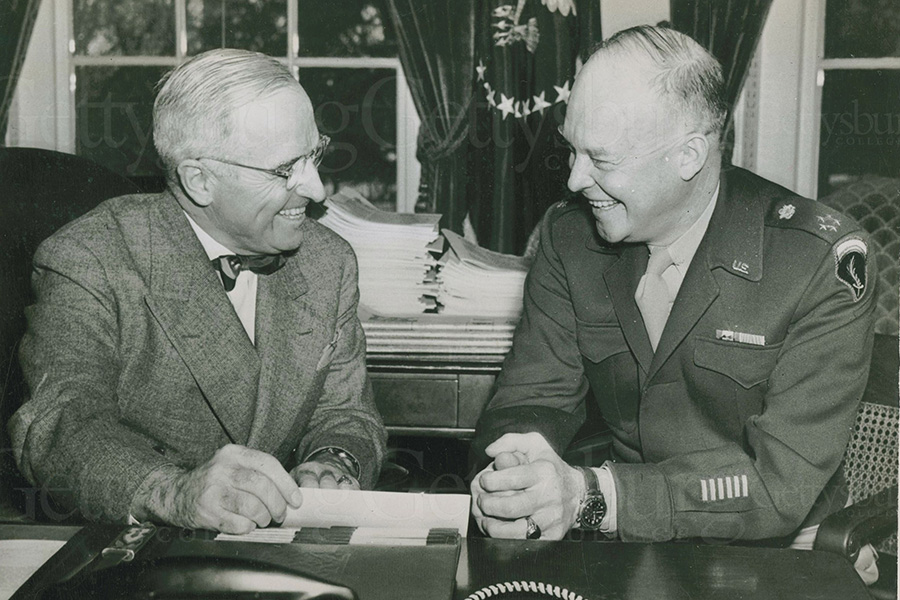 A photo of two men discussing