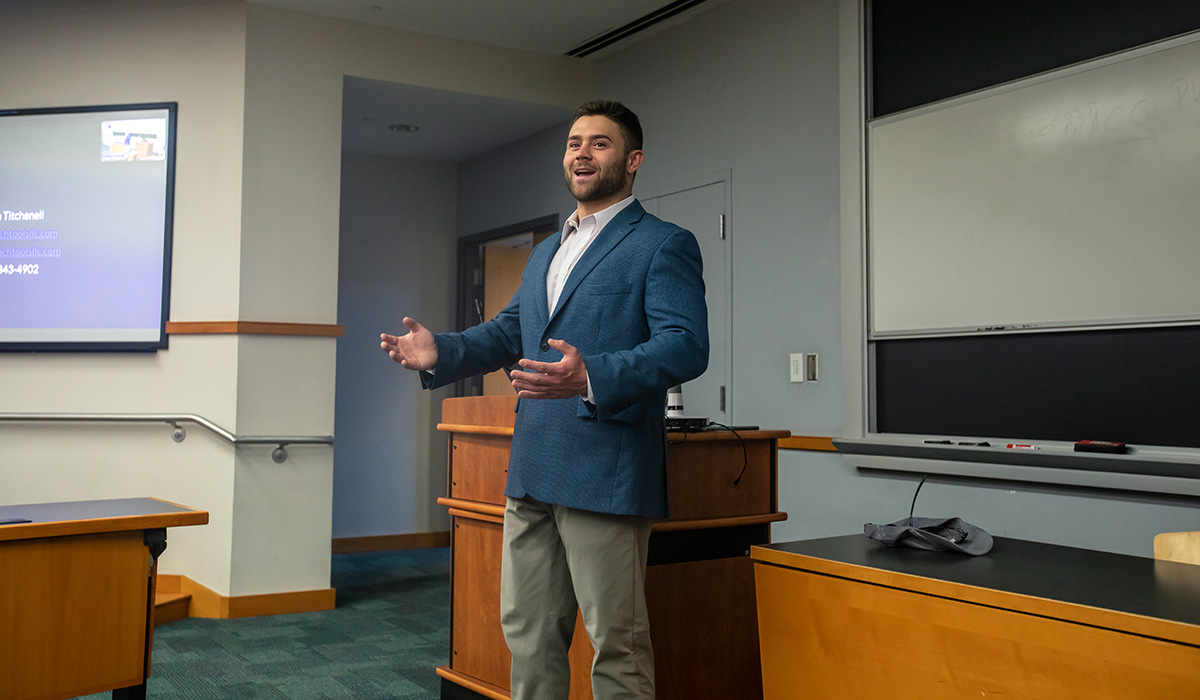 Justin Titchenall speaking to a class