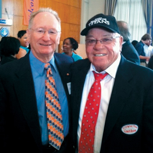 Gareth V. “Lefty” Biser ’57 with T.C. Williams coach Herman Boone