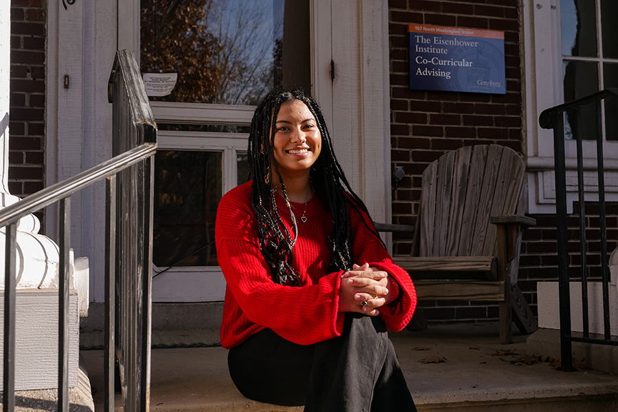 Meriem sits in front of the Eisenhower Institute