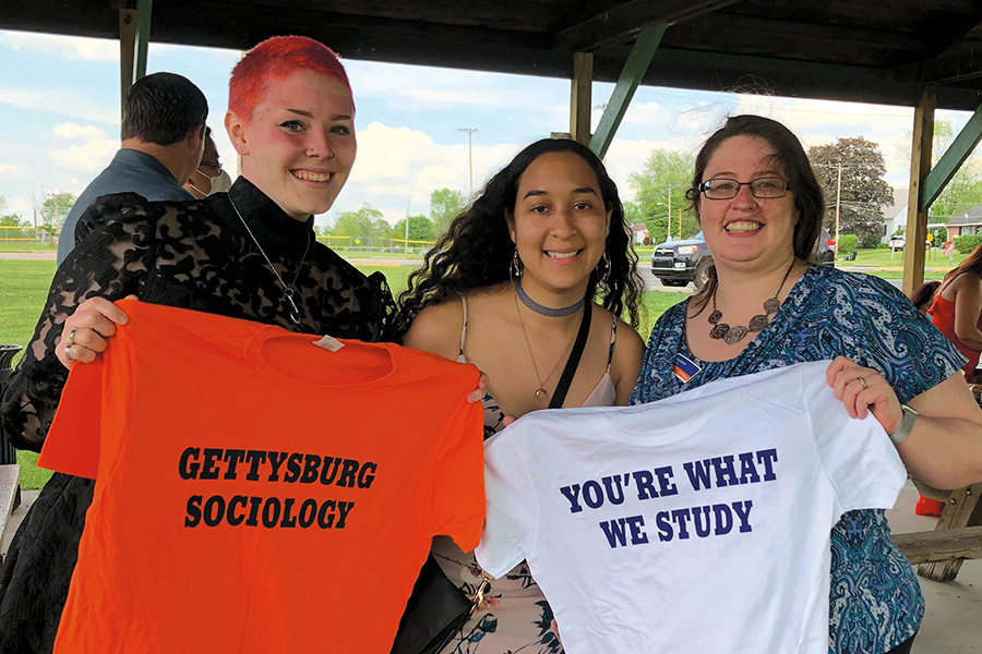 Prof. Alecea Standlee celebrates at a post-graduation event