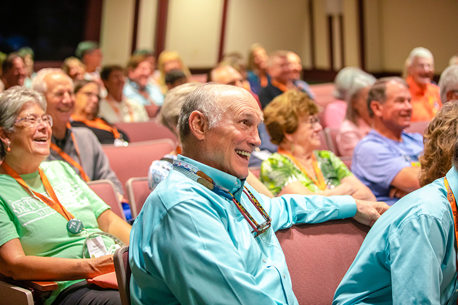 Alumni share a laugh during a stand-up comedy