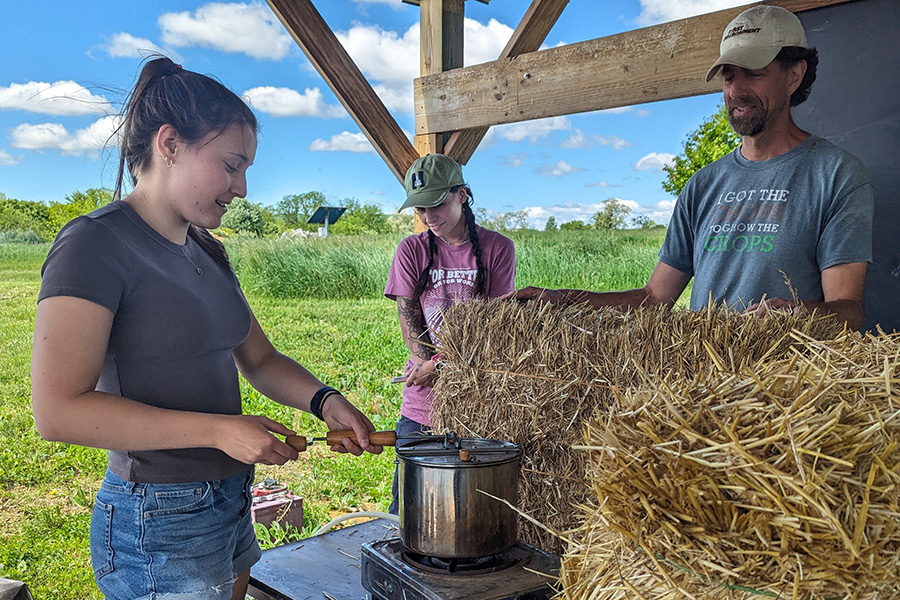 Bramley Hawkins ’25 cooking popcorn on a bioethanol stove