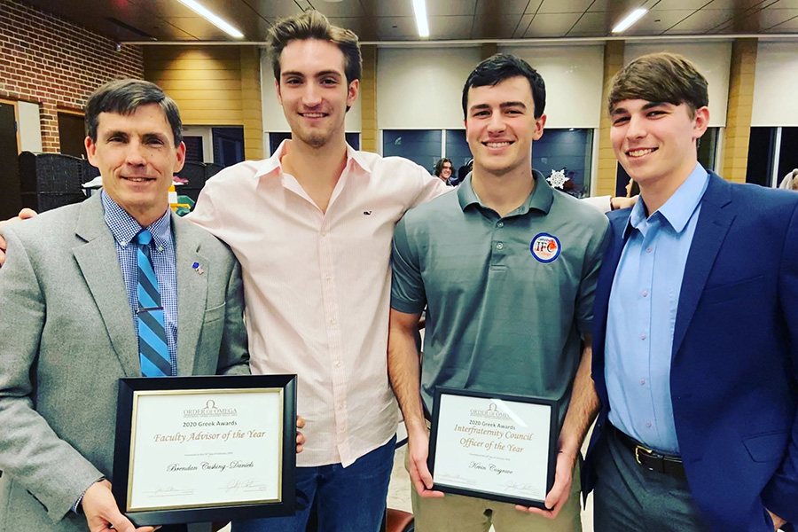 Prof. Brendan Cushing-Daniels alongside Nate Carlson ’20, Kevin Cosgrave ’20, and Peter McQuade