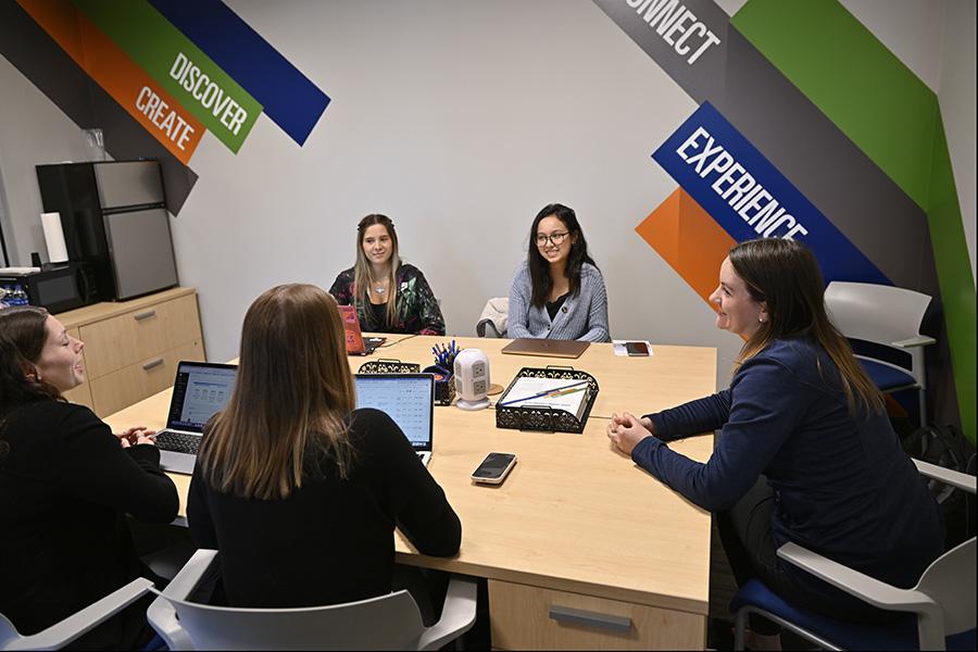 Students discussing at the table