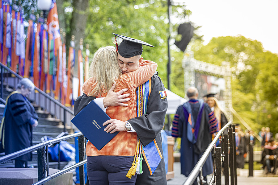 Jack Comegno ’24 embraces his mother, Marsha (Hoffman) Comegno ’94