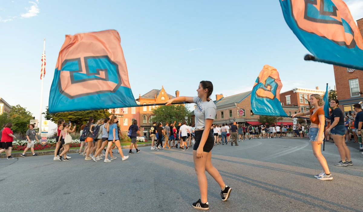 An image of flag bearers waving Gettysburg banners