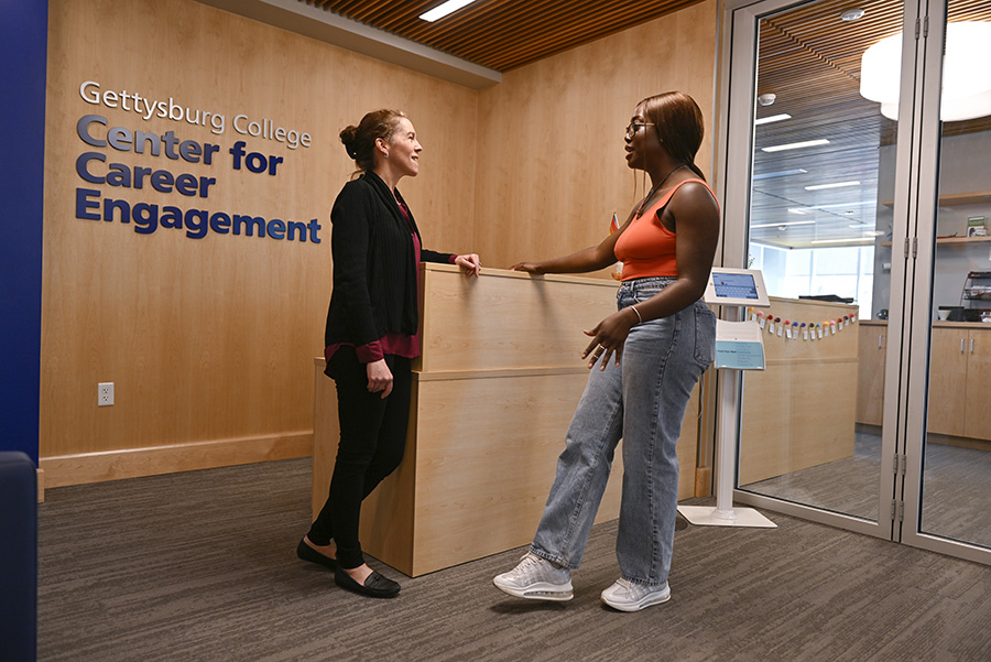 Two people talking at the Center for Career Engagement