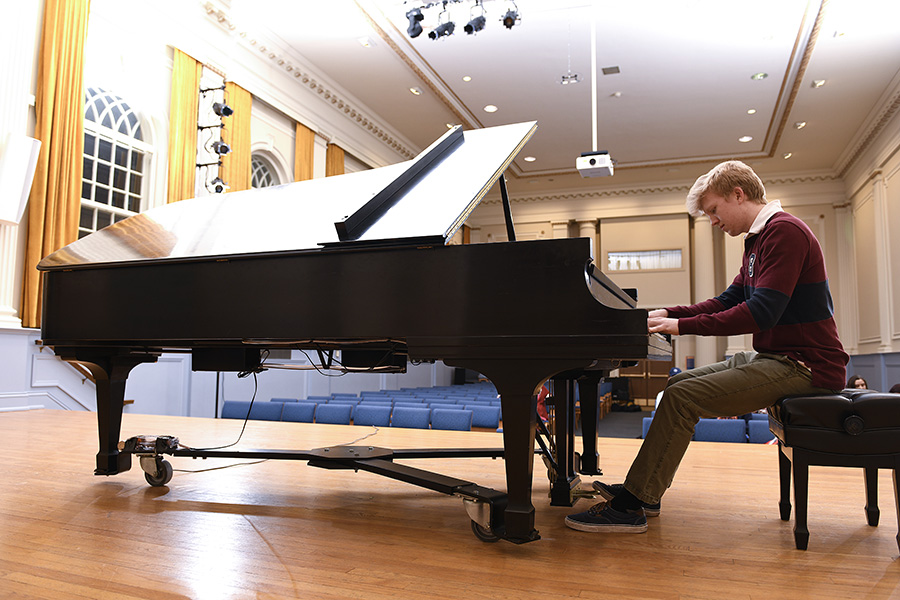 A student playing the piano