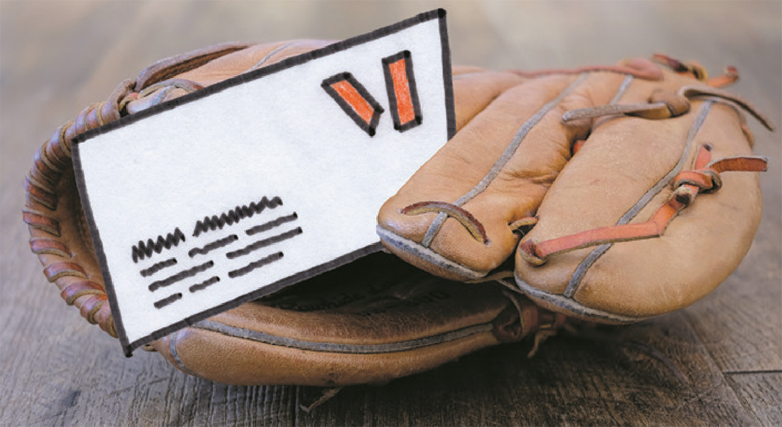A baseball glove with an envelope tucked inside