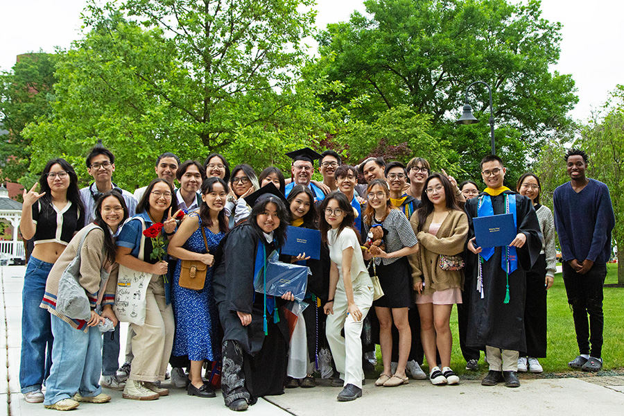 International students gather around Director of International Student Services Brad Lancaster