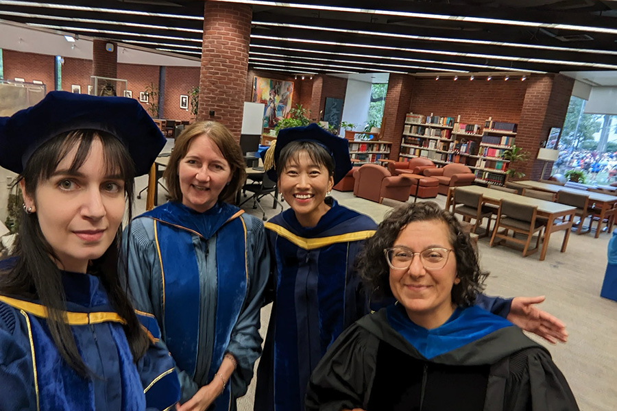 Prof. Alauna Safarpour (left) with Political Science Prof. Caroline Hartzell, Prof. Ae Sil Woo, and Prof. Yasemin Akbab following opening Convocation.