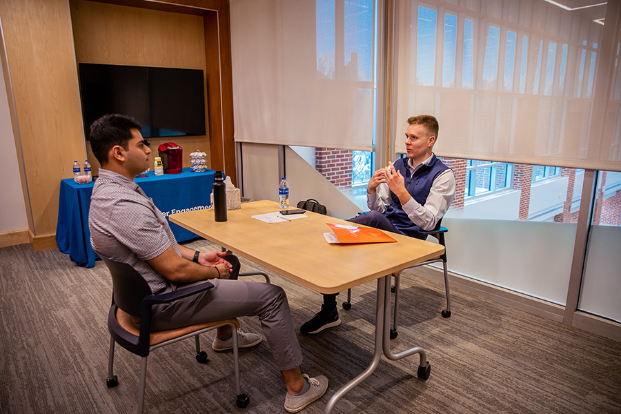 Richard discussing with a student