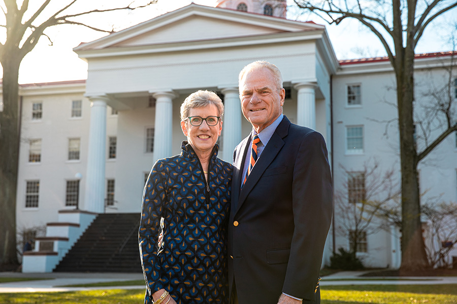 Joan ’76 and Rick Schweizer ’76 pose in front of Penn Hall